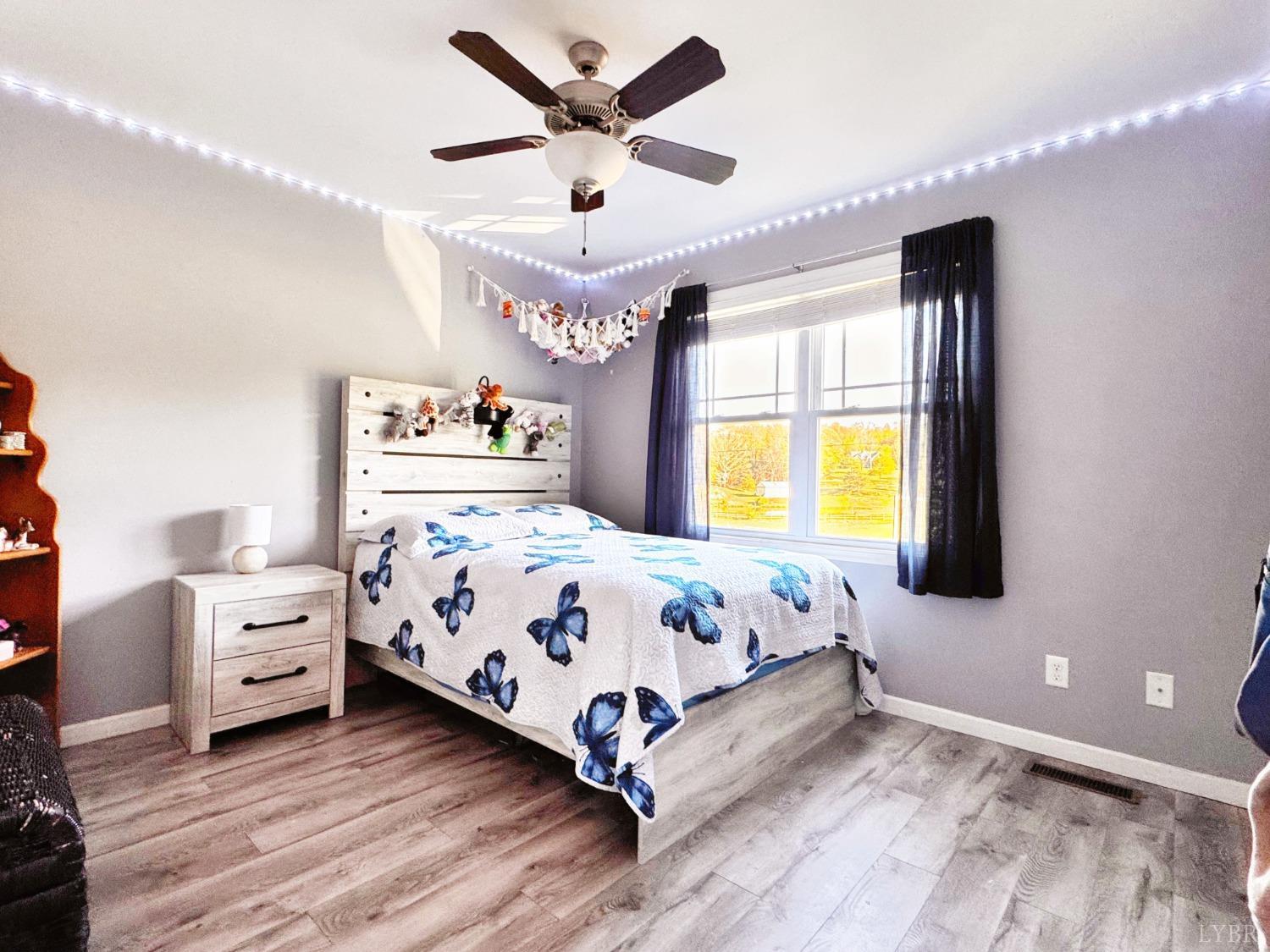 2312 Matthew Talbot Road Forest, VA 24551 - Photo 17 of 36 a bedroom with a bed and window