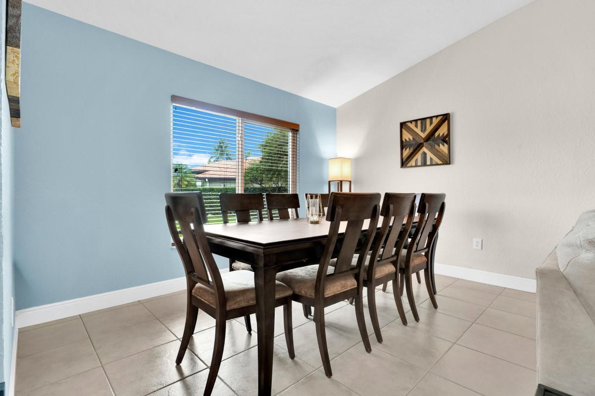 14809 Southwest 154th Court Miami, FL 33196 - Photo 12 of 30 a view of a dining room with furniture and window