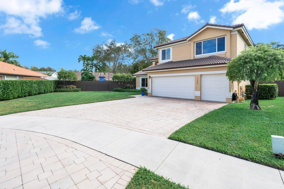 14809 Southwest 154th Court Miami, FL 33196 - Photo 2 of 30 a view of a house with a yard and large tree