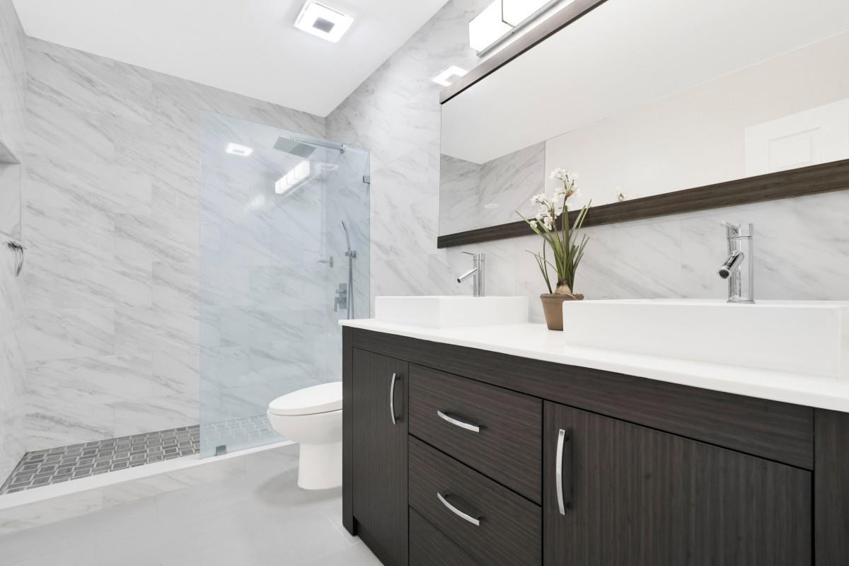 14809 Southwest 154th Court Miami, FL 33196 - Photo 21 of 30 a bathroom with a double vanity sink toilet and a mirror