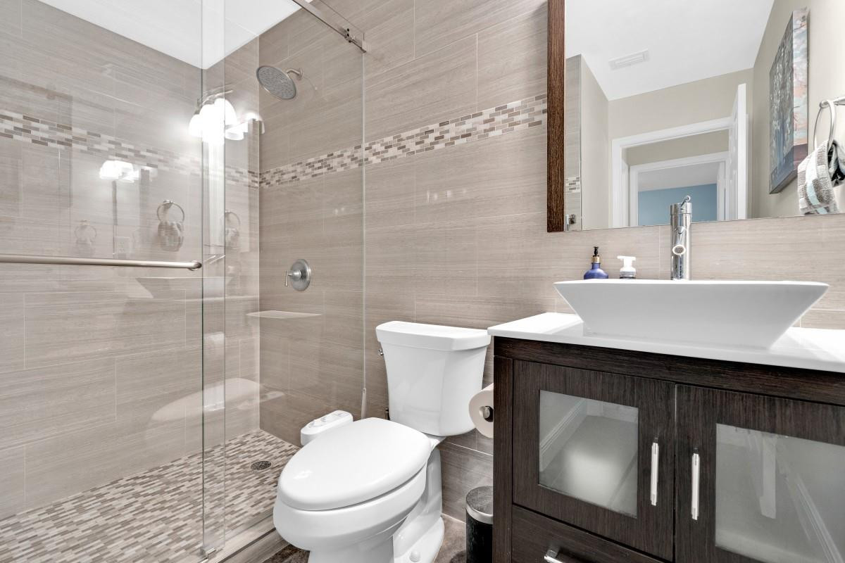 14809 Southwest 154th Court Miami, FL 33196 - Photo 22 of 30 a bathroom with a sink toilet and shower