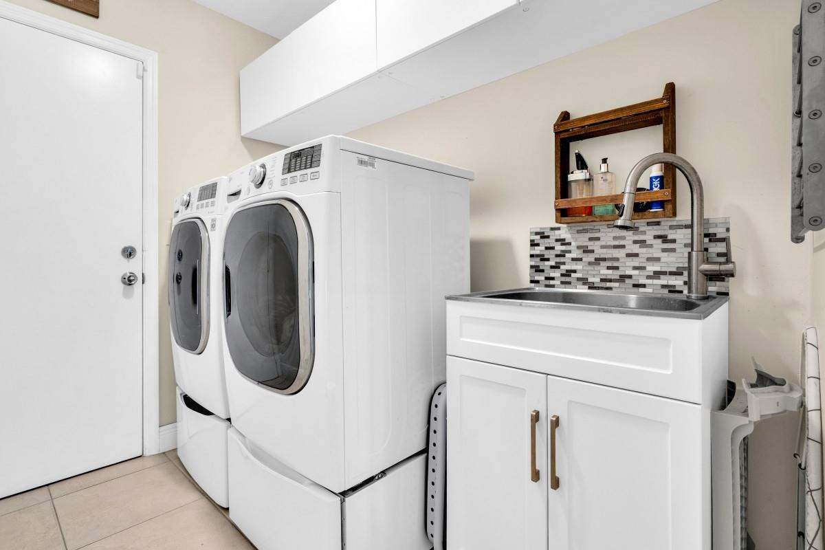 14809 Southwest 154th Court Miami, FL 33196 - Photo 23 of 30 a utility room with dryer and washer