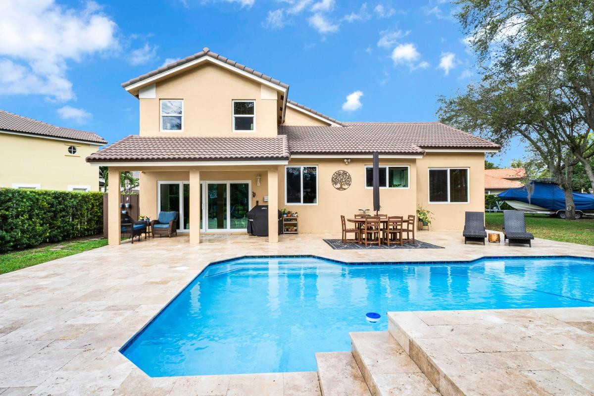 14809 Southwest 154th Court Miami, FL 33196 - Photo 24 of 30 a front view of a house with yard and garage