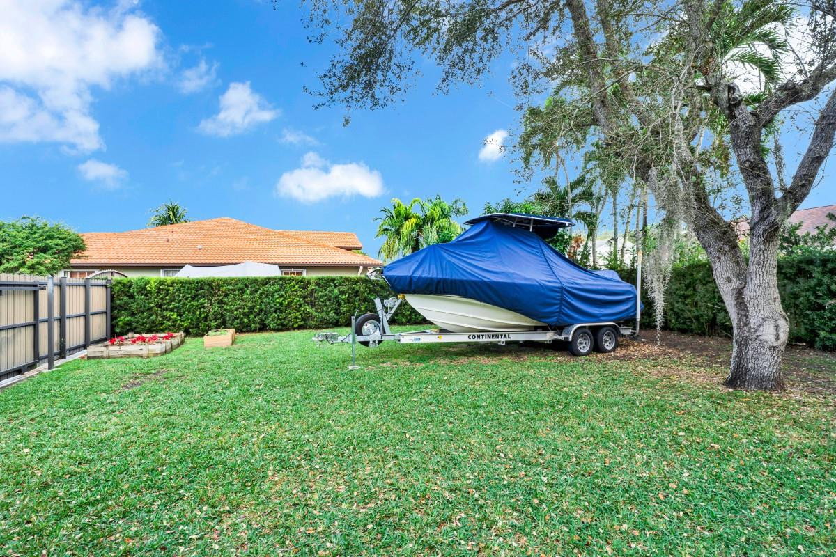 14809 Southwest 154th Court Miami, FL 33196 - Photo 28 of 30 a backyard of a house with lots of green space