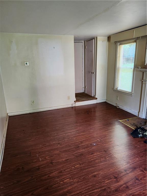 8624 Oakcrest Road Pittsburgh, PA 15235 - Photo 4 of 20 an empty room with wooden floor and windows