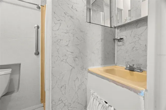 a bathroom with a sink and a shower