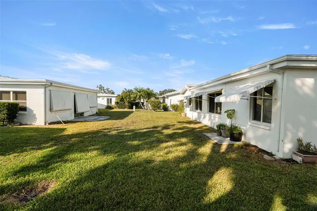 a front view of house with yard outdoor seating and green space