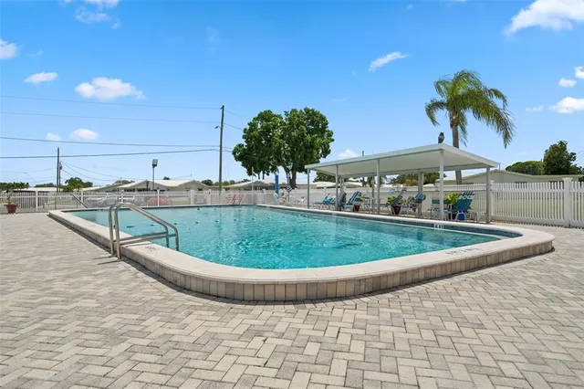 a dining room with furniture and a book shelf