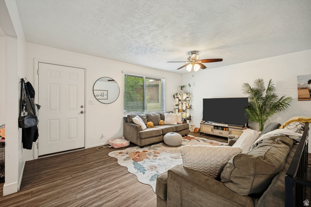 6709 Acoma Road, Unit 239 Midvale, UT 84047 - Photo 5 of 38 6711 - Wood-finish flooring, white walls, and a ceiling fan with integrated lighting