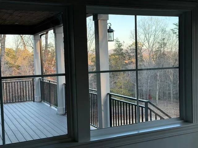 a view of a balcony with wooden floor