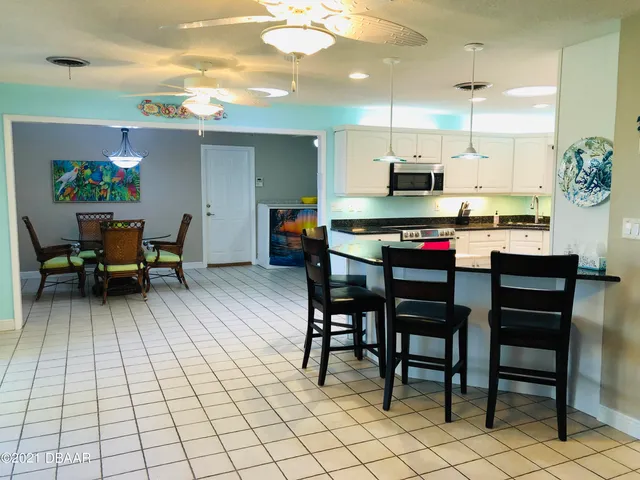 a kitchen with a sink cabinets and window