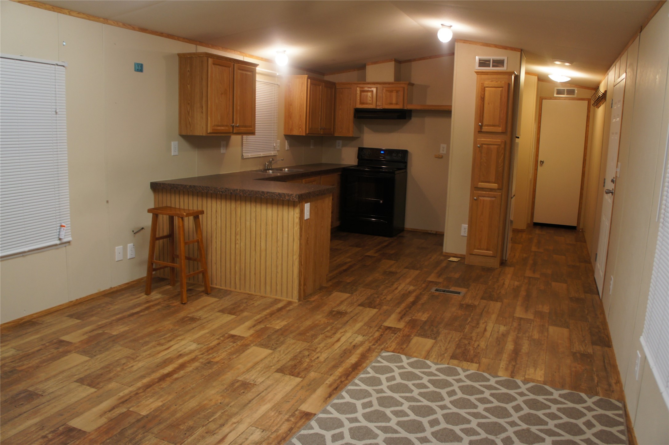 601 Clear Lake Road, Unit A Highlands, TX 77562 - Photo 13 of 17 a kitchen with stainless steel appliances granite countertop a refrigerator and a stove