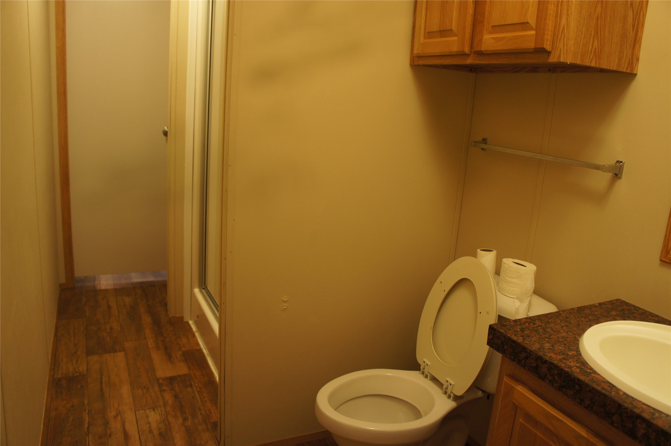 601 Clear Lake Road, Unit A Highlands, TX 77562 - Photo 14 of 17 a bathroom with a granite countertop toilet and sink