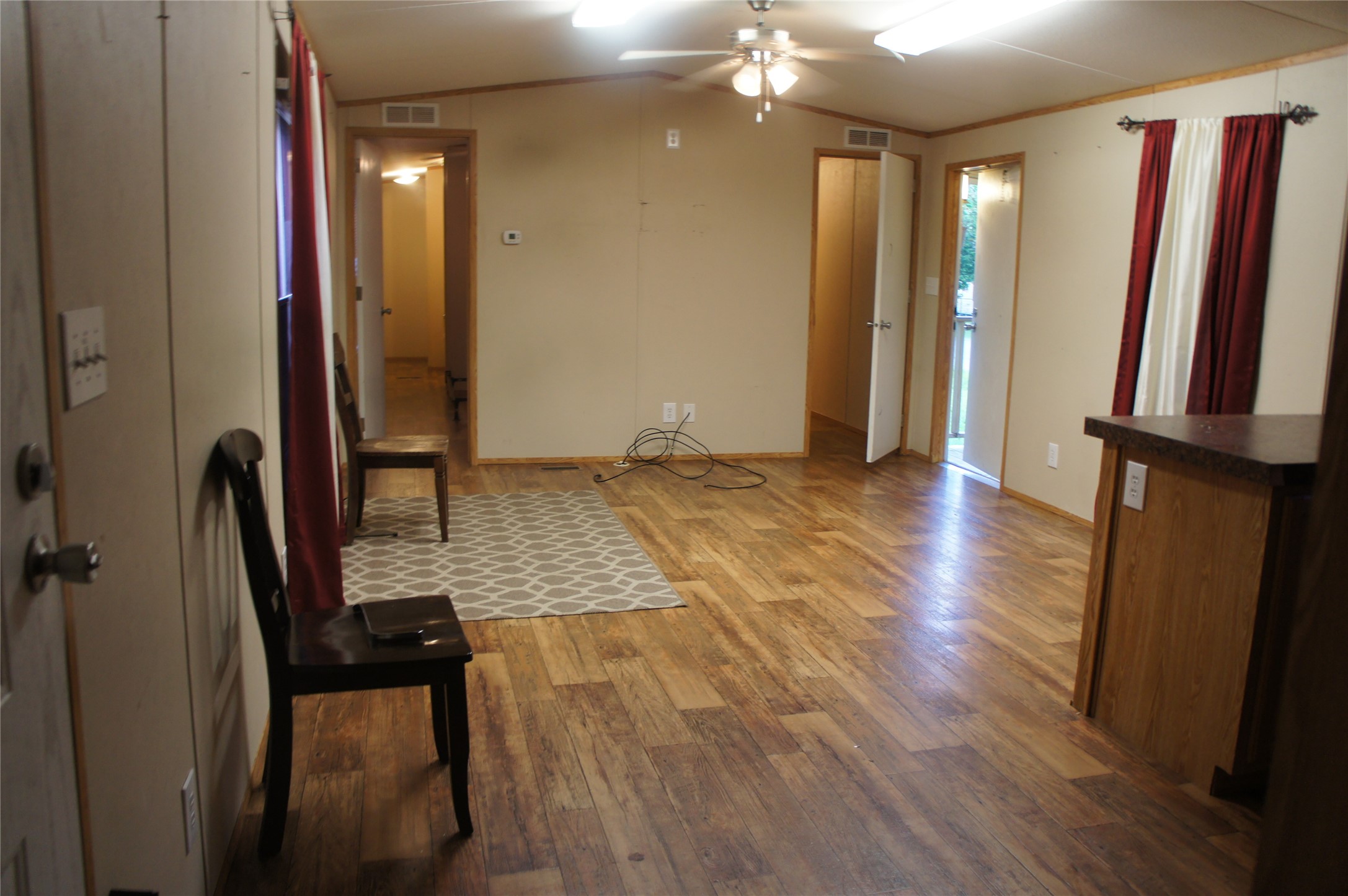 601 Clear Lake Road, Unit A Highlands, TX 77562 - Photo 9 of 17 a view of a hallway with wooden floor and staircase