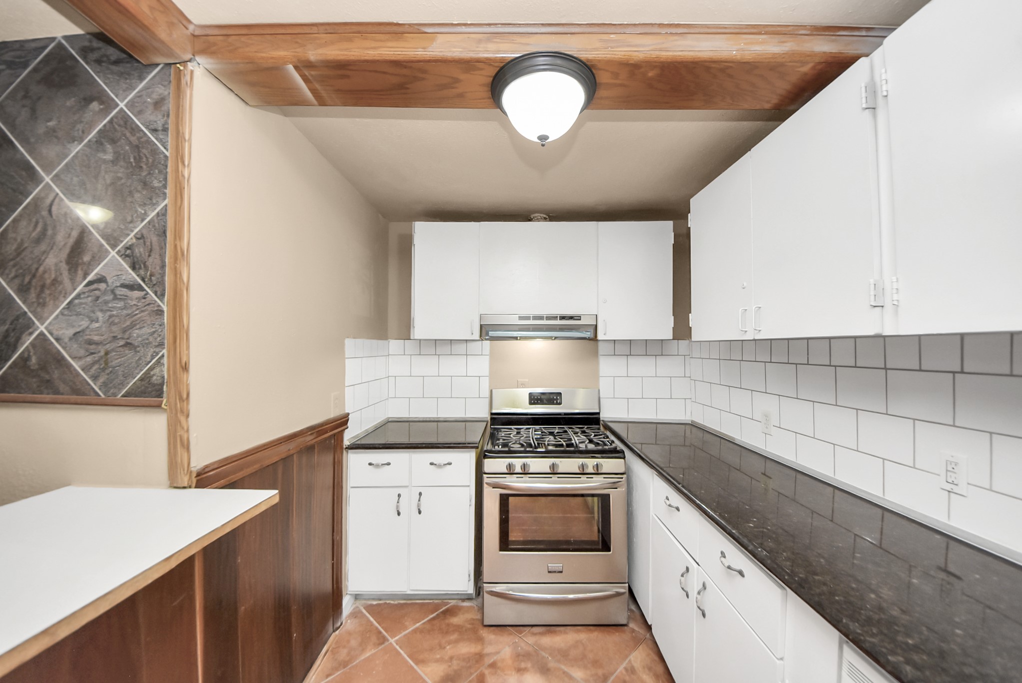 2510 Delaware Avenue League City, TX 77573 - Photo 17 of 38 a kitchen with a stove a sink and a refrigerator