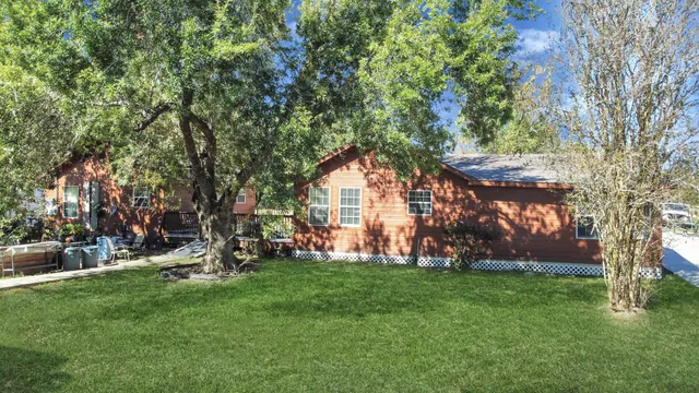a backyard of a house with lots of green space