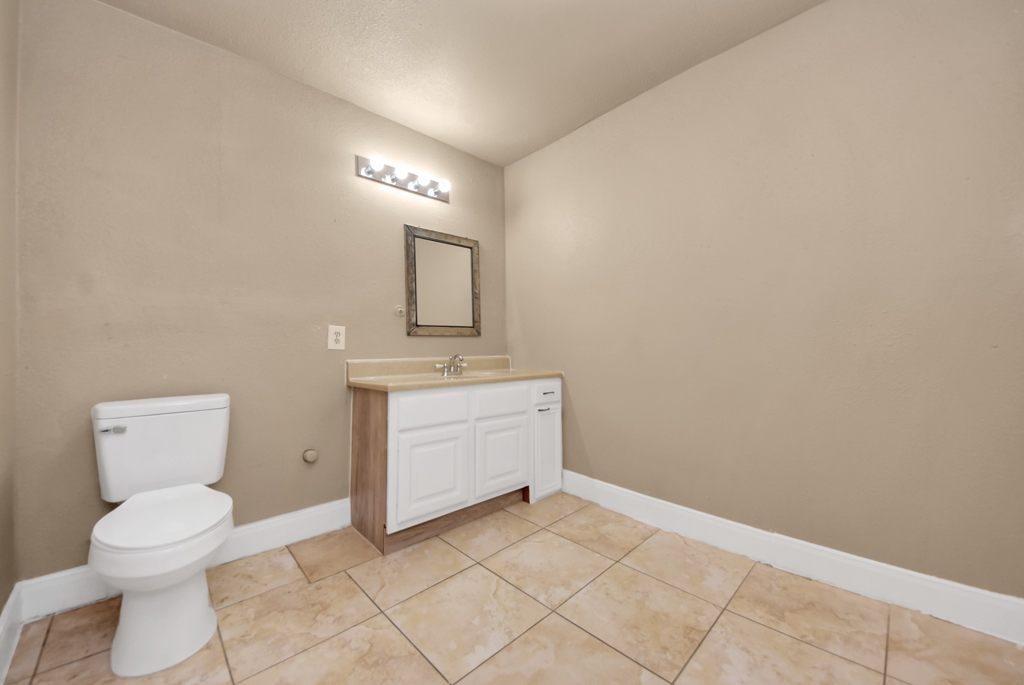2510 Delaware Avenue League City, TX 77573 - Photo 23 of 38 a bathroom with a toilet sink and mirror
