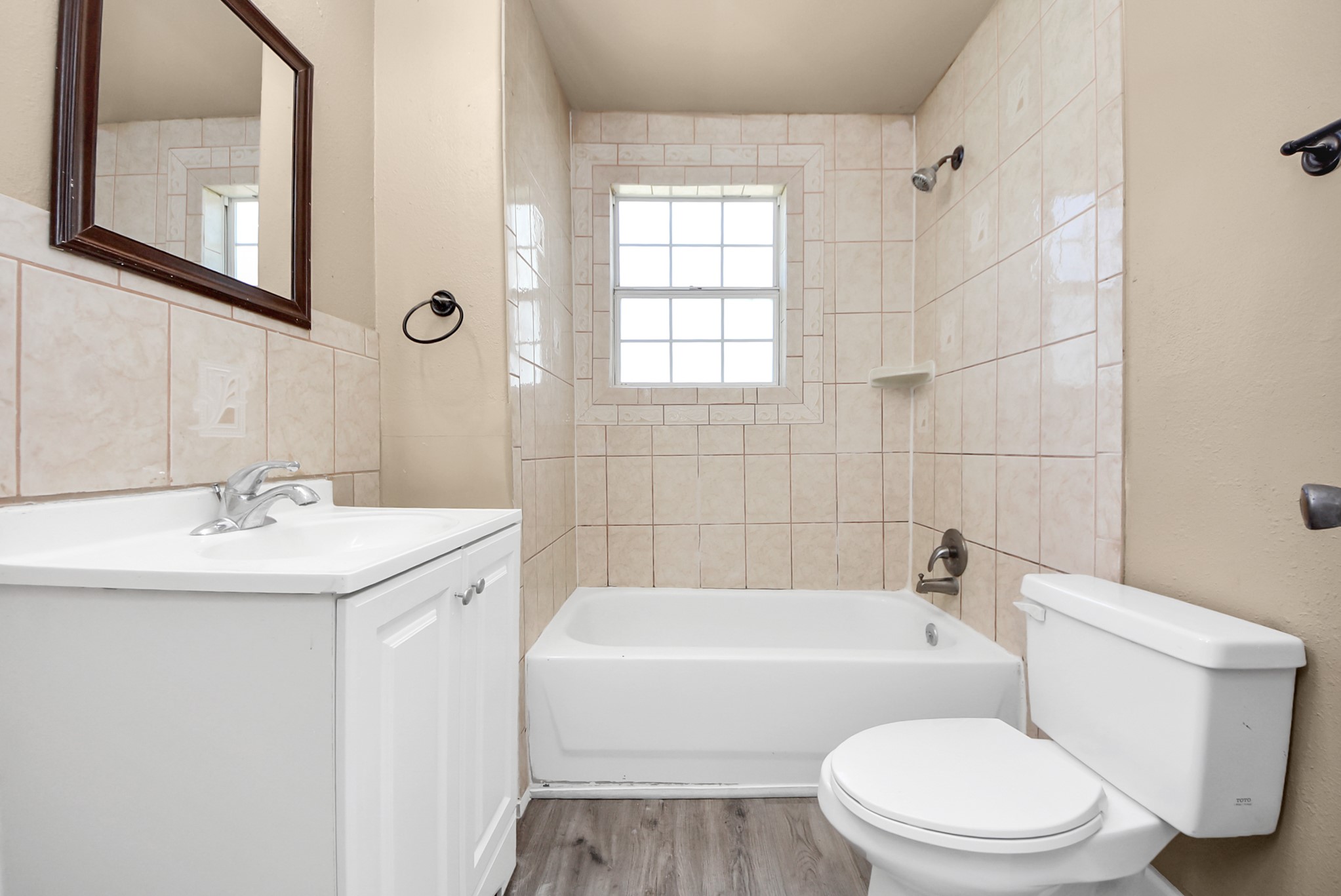 2510 Delaware Avenue League City, TX 77573 - Photo 25 of 38 a bathroom with a sink a toilet and shower
