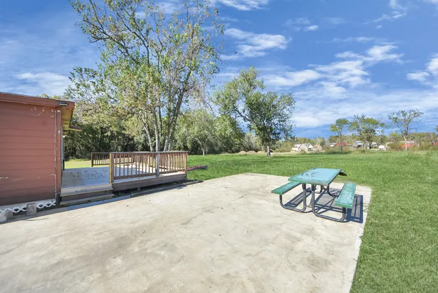 a view of a park with iron fence