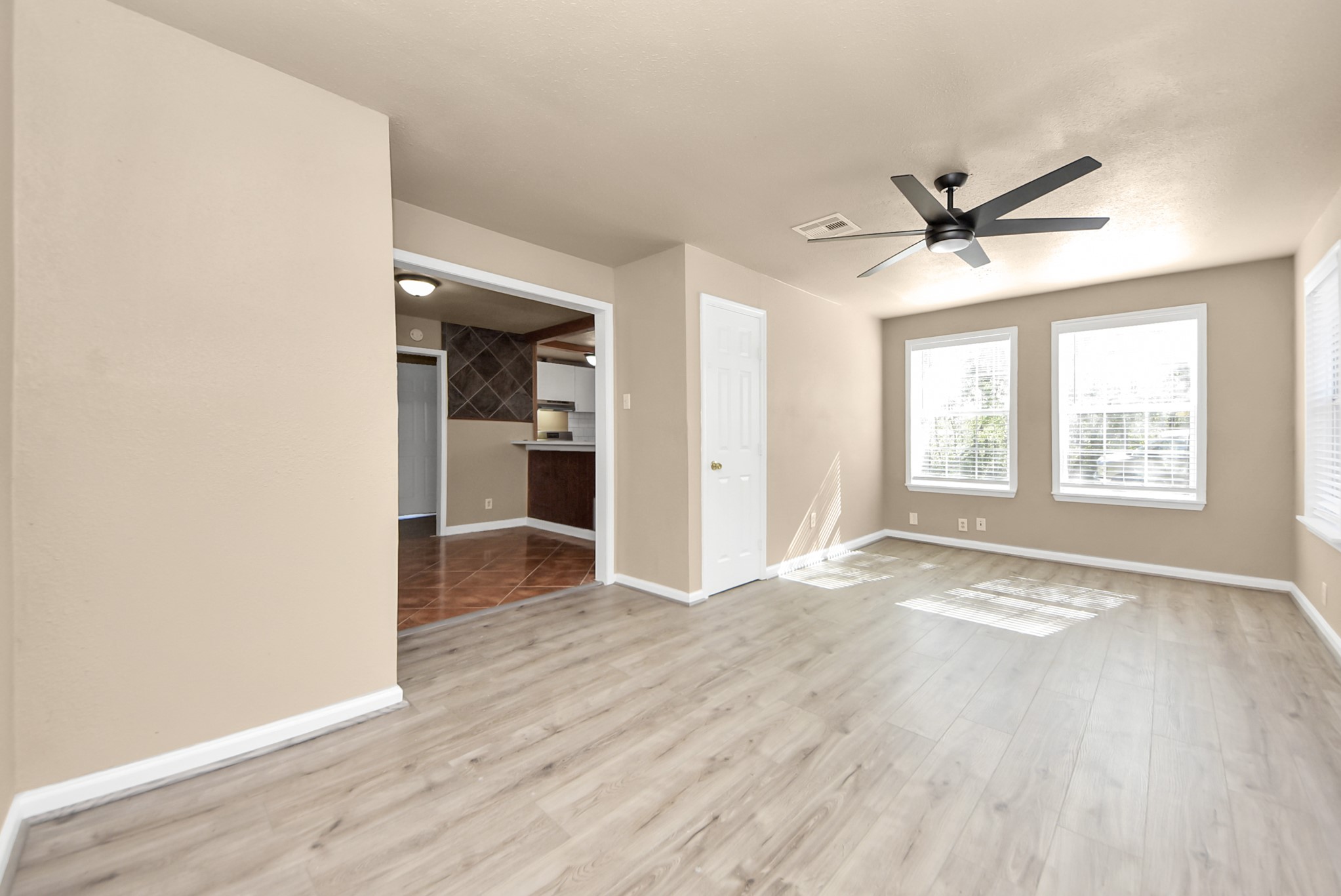 2510 Delaware Avenue League City, TX 77573 - Photo 4 of 38 wooden floor in an empty room with a window