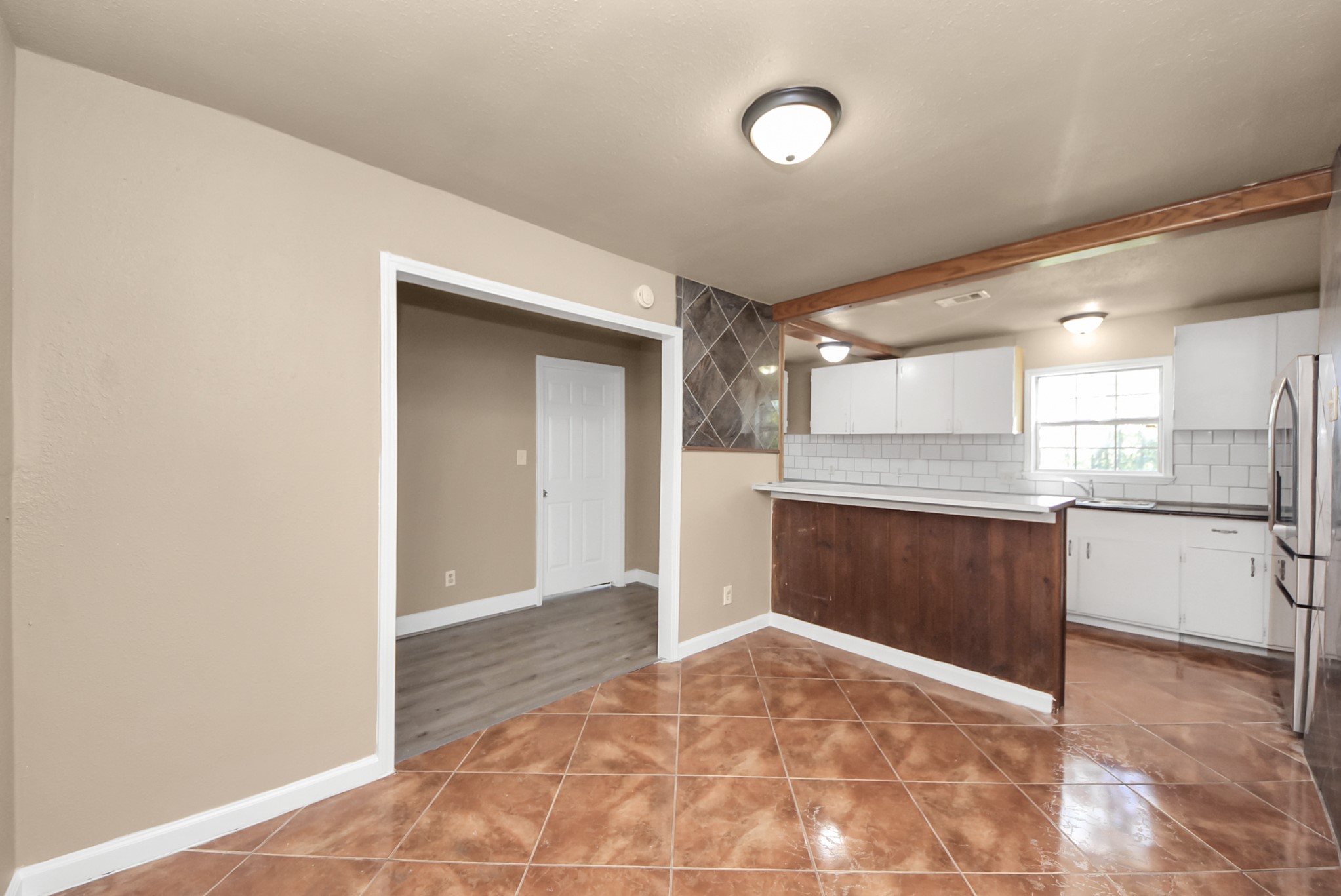 2510 Delaware Avenue League City, TX 77573 - Photo 8 of 38 a view of a kitchen with a sink and cabinets