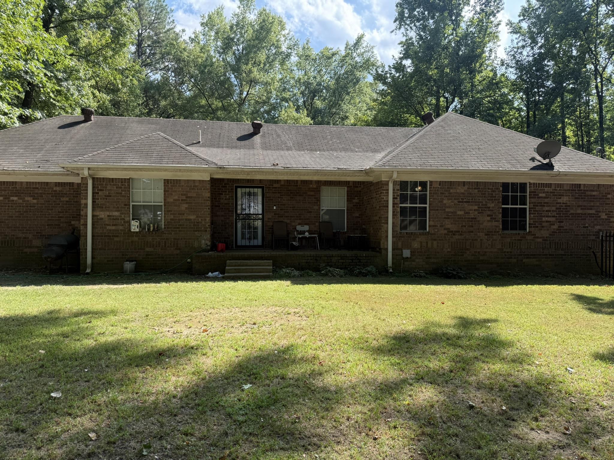 4532 Kassell Road Memphis, TN 38116 - Photo 4 of 39 Brick exterior with a covered patio and multiple windows