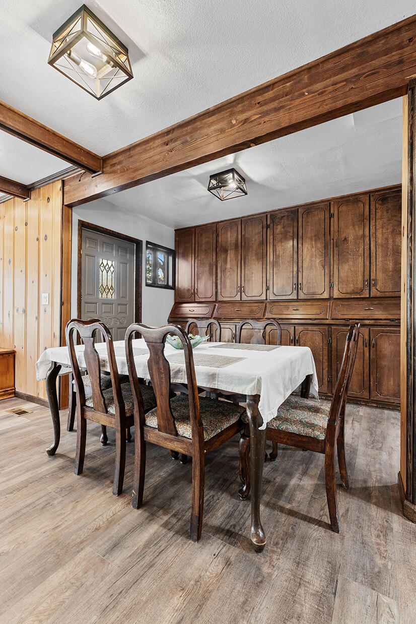 2900 Indian Creek Road Shady Cove, OR 97539 - Photo 7 of 35 a view of a a dining room with furniture window and wooden floor
