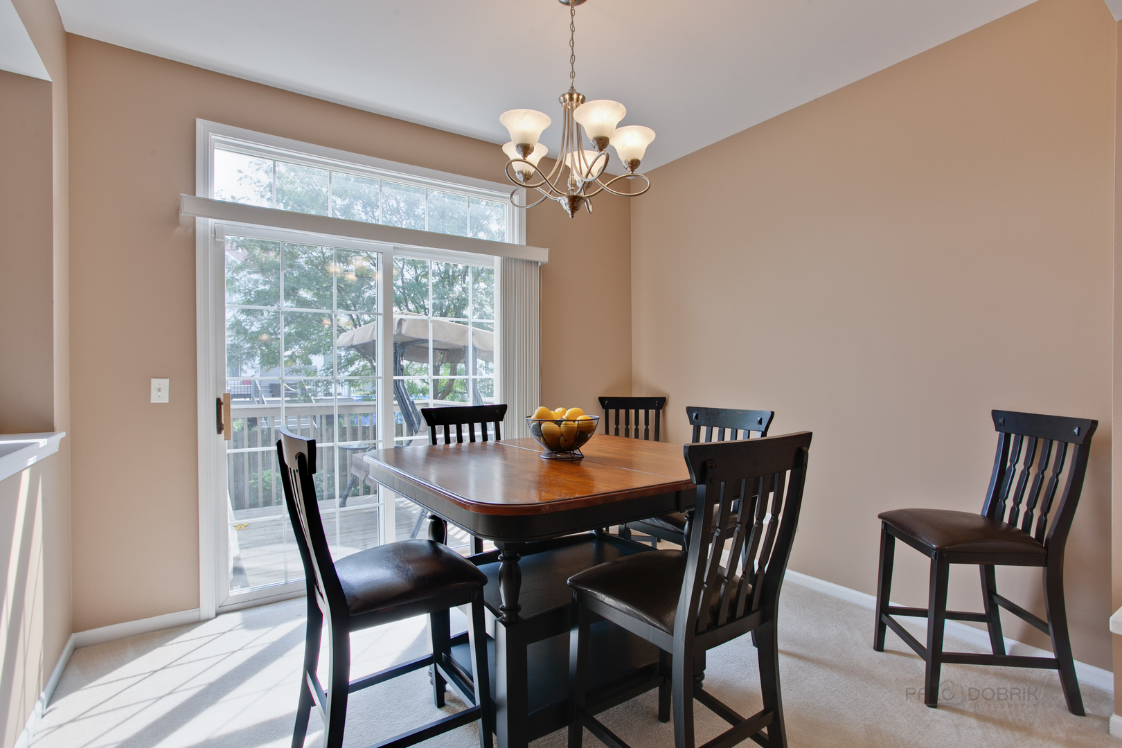 5451 McDonough Road Hoffman Estates, IL 60192 - Photo 11 of 30 a view of a dining room with furniture a chandelier and wooden floor