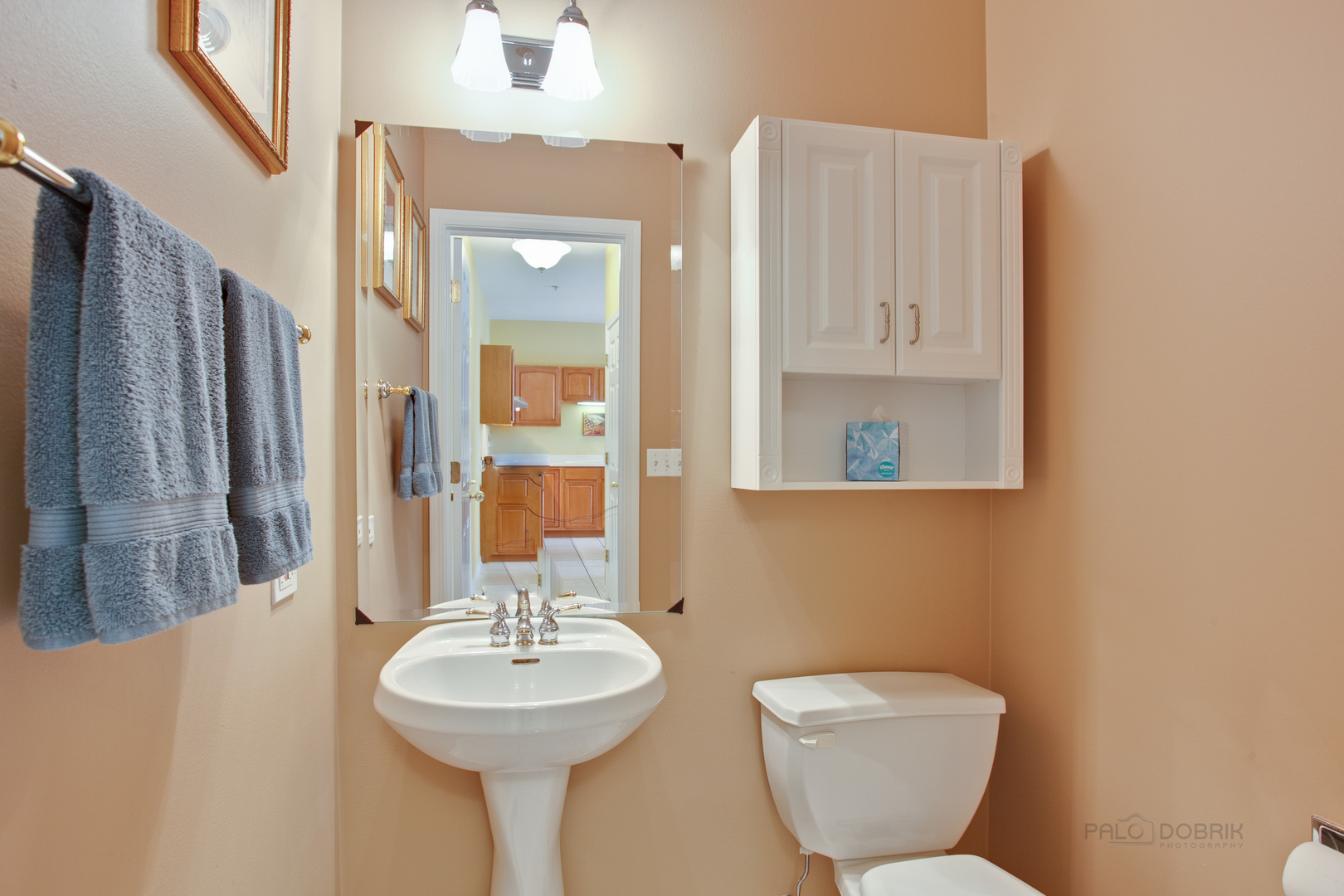 5451 McDonough Road Hoffman Estates, IL 60192 - Photo 12 of 30 a bathroom with a toilet sink and mirror