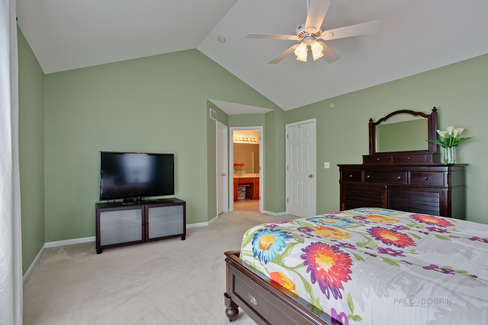 5451 McDonough Road Hoffman Estates, IL 60192 - Photo 15 of 30 a bedroom with a bed and a flat screen tv on dresser