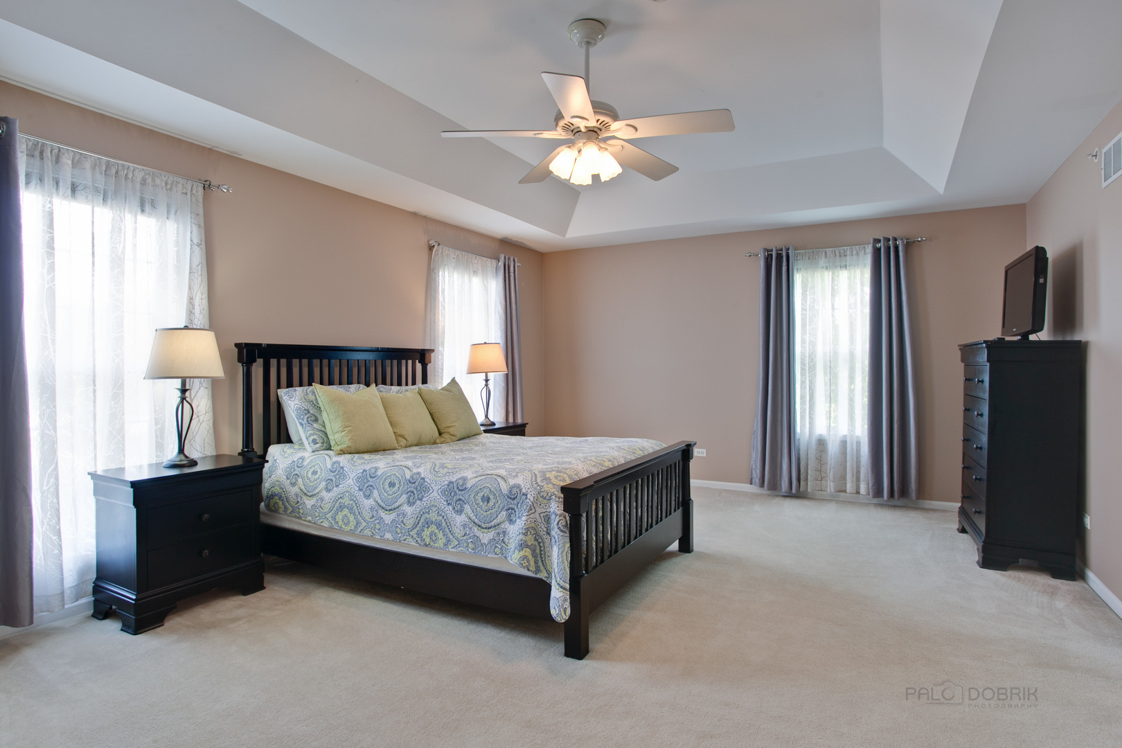 5451 McDonough Road Hoffman Estates, IL 60192 - Photo 18 of 30 a bedroom with a bed and a chandelier