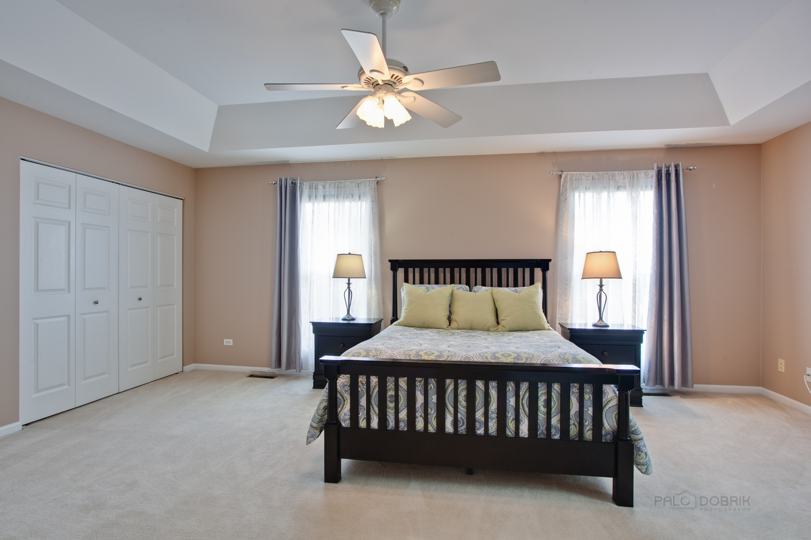 5451 McDonough Road Hoffman Estates, IL 60192 - Photo 19 of 30 a bedroom with a bed and a chandelier