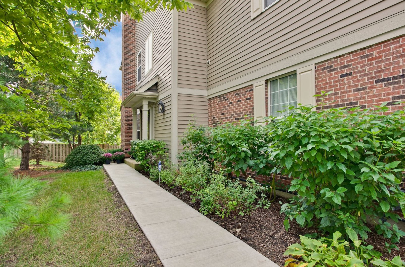 5451 McDonough Road Hoffman Estates, IL 60192 - Photo 27 of 30 a front view of a house with garden