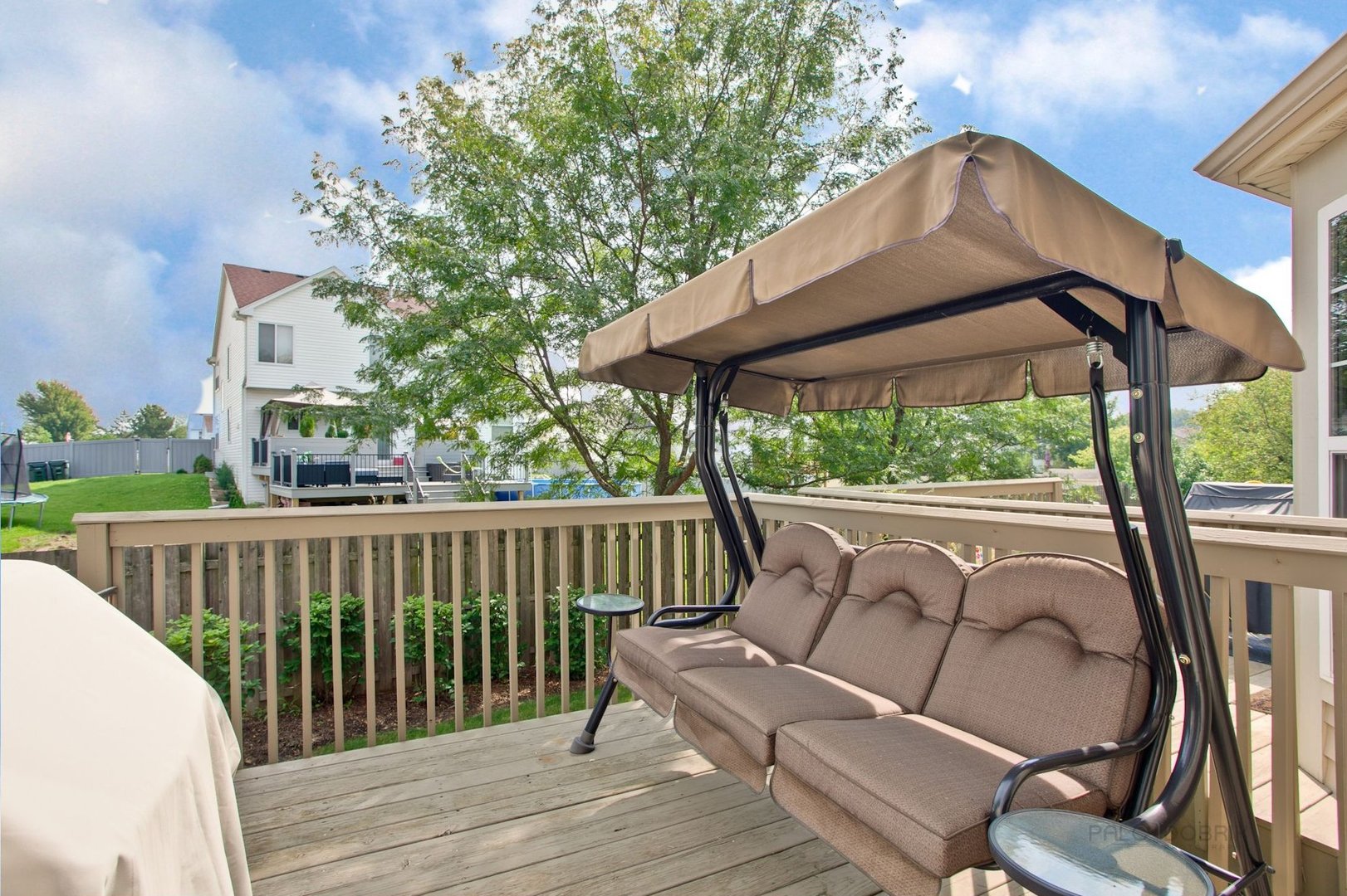 5451 McDonough Road Hoffman Estates, IL 60192 - Photo 28 of 30 a view of balcony with furniture and red umbrella