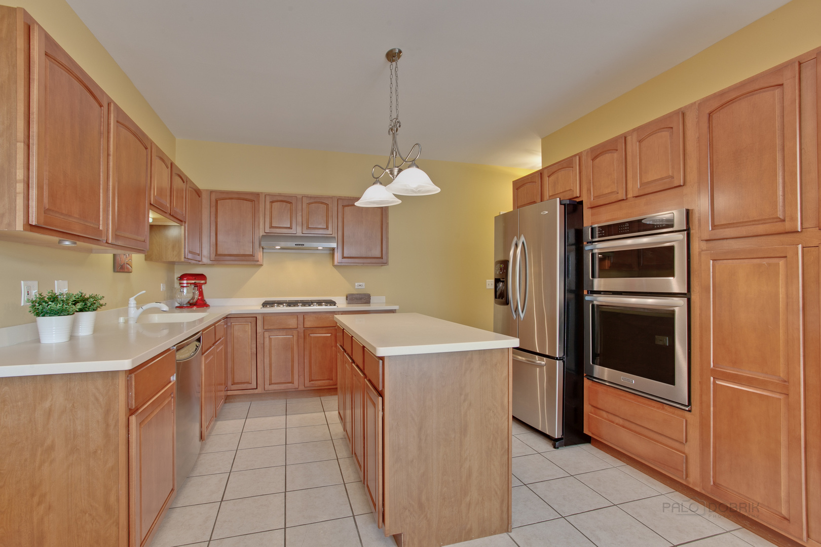 5451 McDonough Road Hoffman Estates, IL 60192 - Photo 5 of 30 a kitchen with a refrigerator a sink and dishwasher