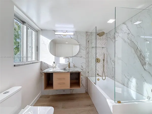 a view of a living room with a bathroom