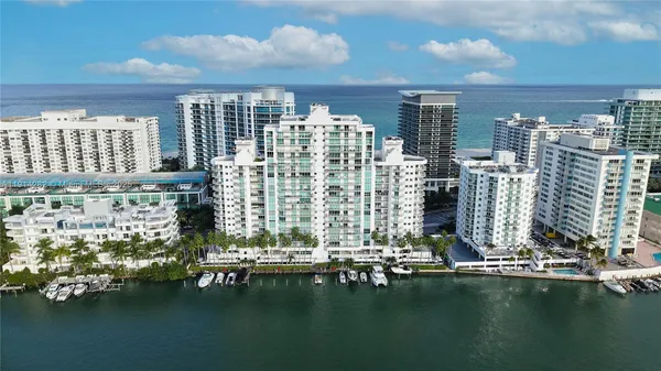 an aerial view of a house with a lake view
