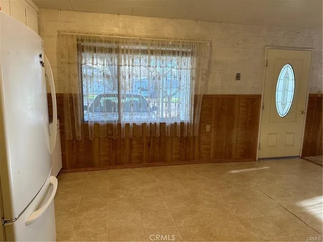 a view of a storage & utility room with closet cabinets