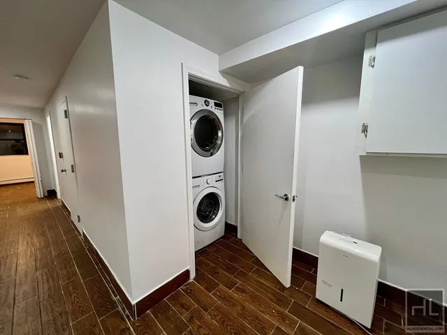 a hallway with washer and dryer