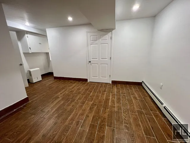 a view of wooden floor in an empty room