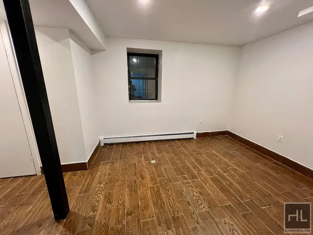 a view of a room with wooden floor and small space