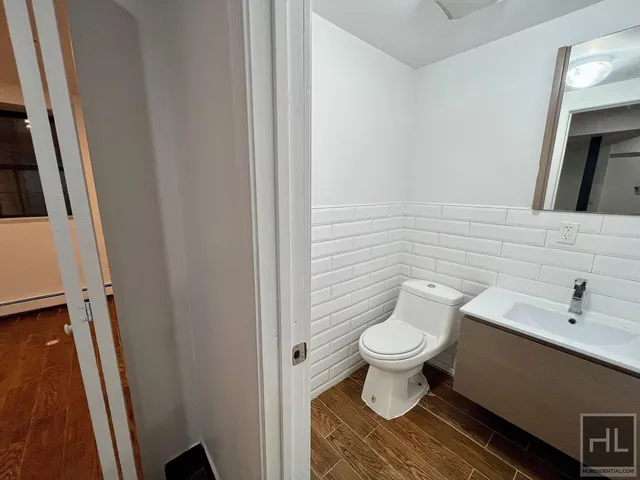 a bathroom with a toilet and a sink