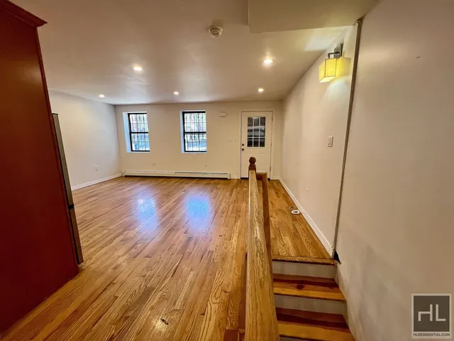 a view of entryway with wooden floor
