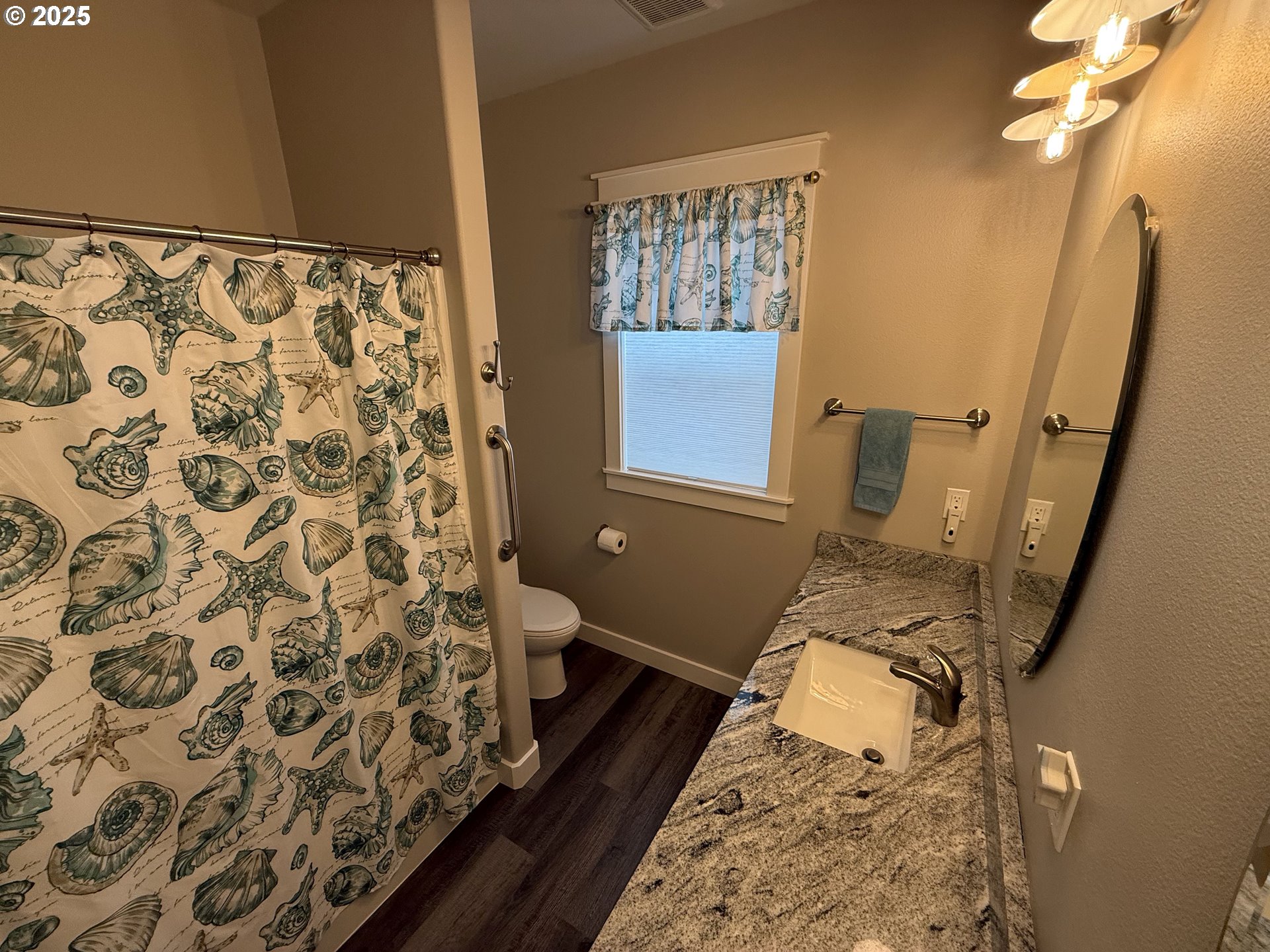 4055 Caddington Lane Florence, OR 97439 - Photo 14 of 48 a bathroom with a sink toilet and shower