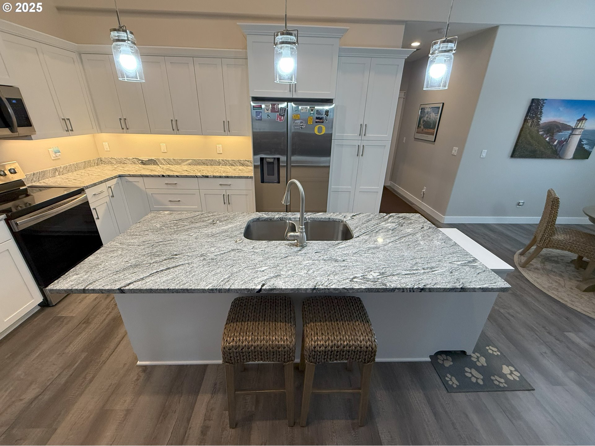 4055 Caddington Lane Florence, OR 97439 - Photo 19 of 48 a kitchen with granite countertop kitchen island stainless steel appliances a sink stove and refrigerator