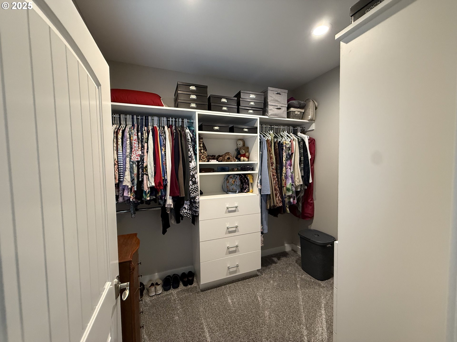 4055 Caddington Lane Florence, OR 97439 - Photo 28 of 48 a view of walk in closet with clothes and shoes