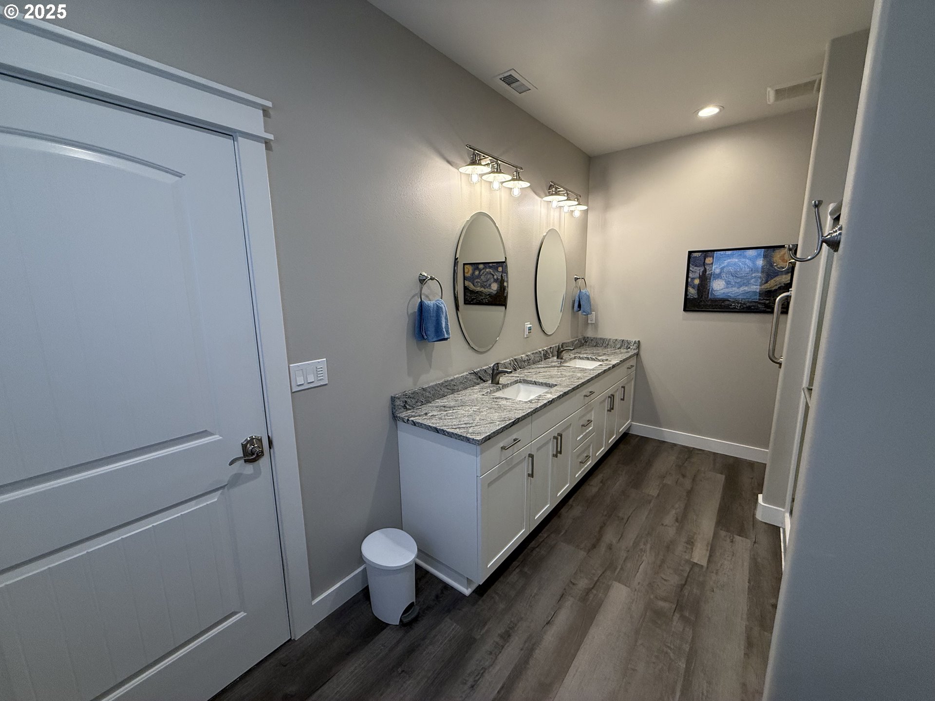 4055 Caddington Lane Florence, OR 97439 - Photo 30 of 48 a spacious bathroom with a granite countertop sink and a mirror