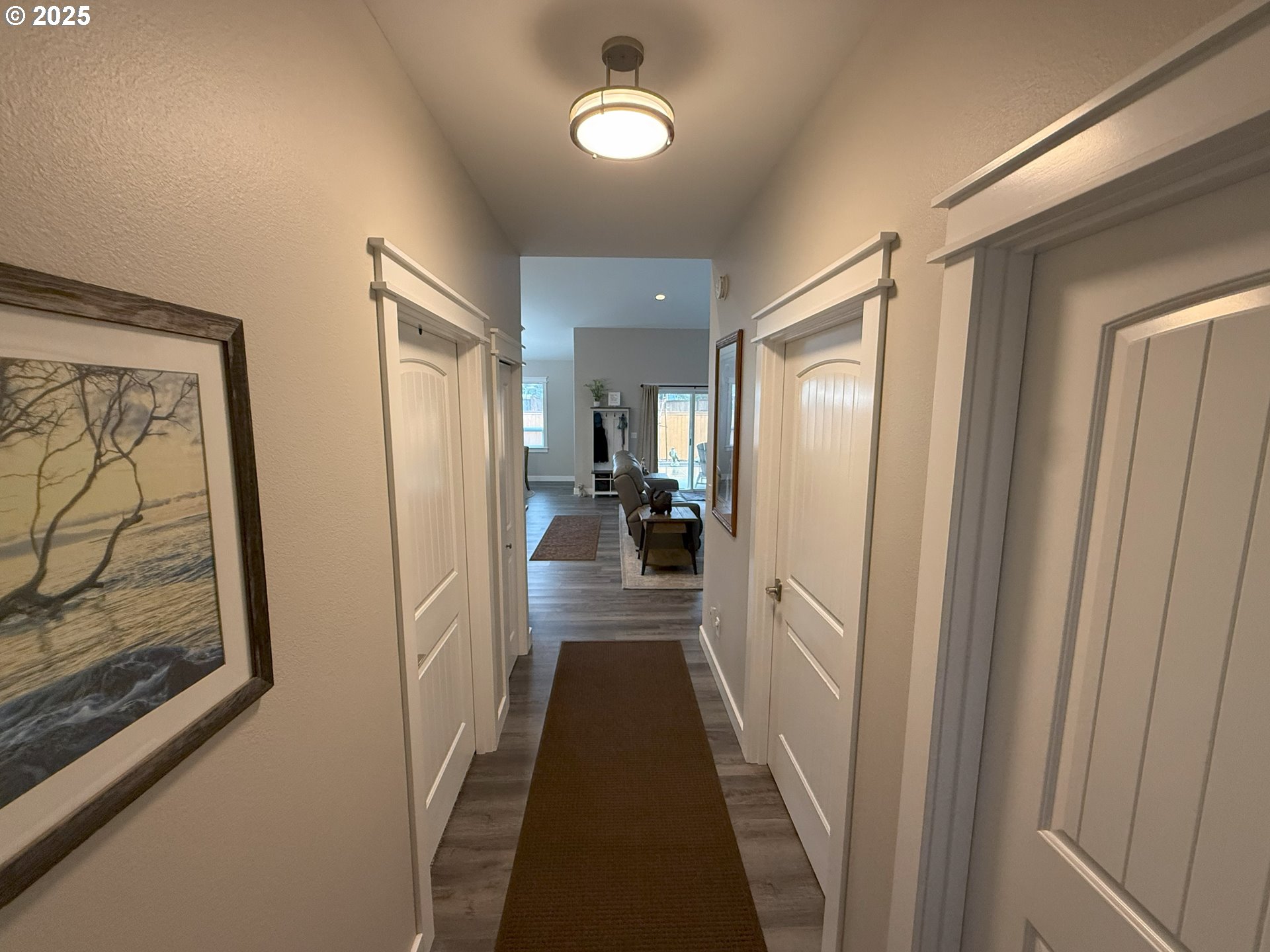 4055 Caddington Lane Florence, OR 97439 - Photo 9 of 48 a view of a hallway with wooden floor and staircase