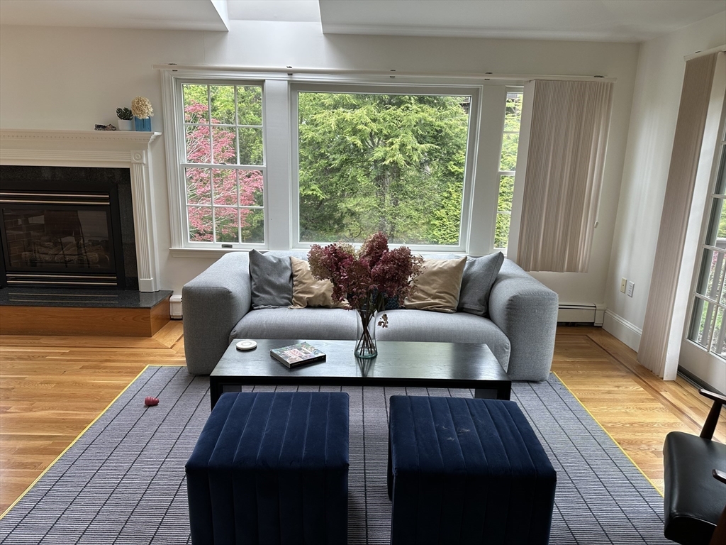 45 Wellesley Road Belmont, MA 02478 - Photo 3 of 42 a living room with furniture and a fireplace