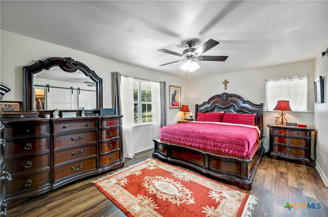 2283 Schwab Road Seguin, TX 78155 - Photo 11 of 40 a bedroom with a bed and a dresser in it